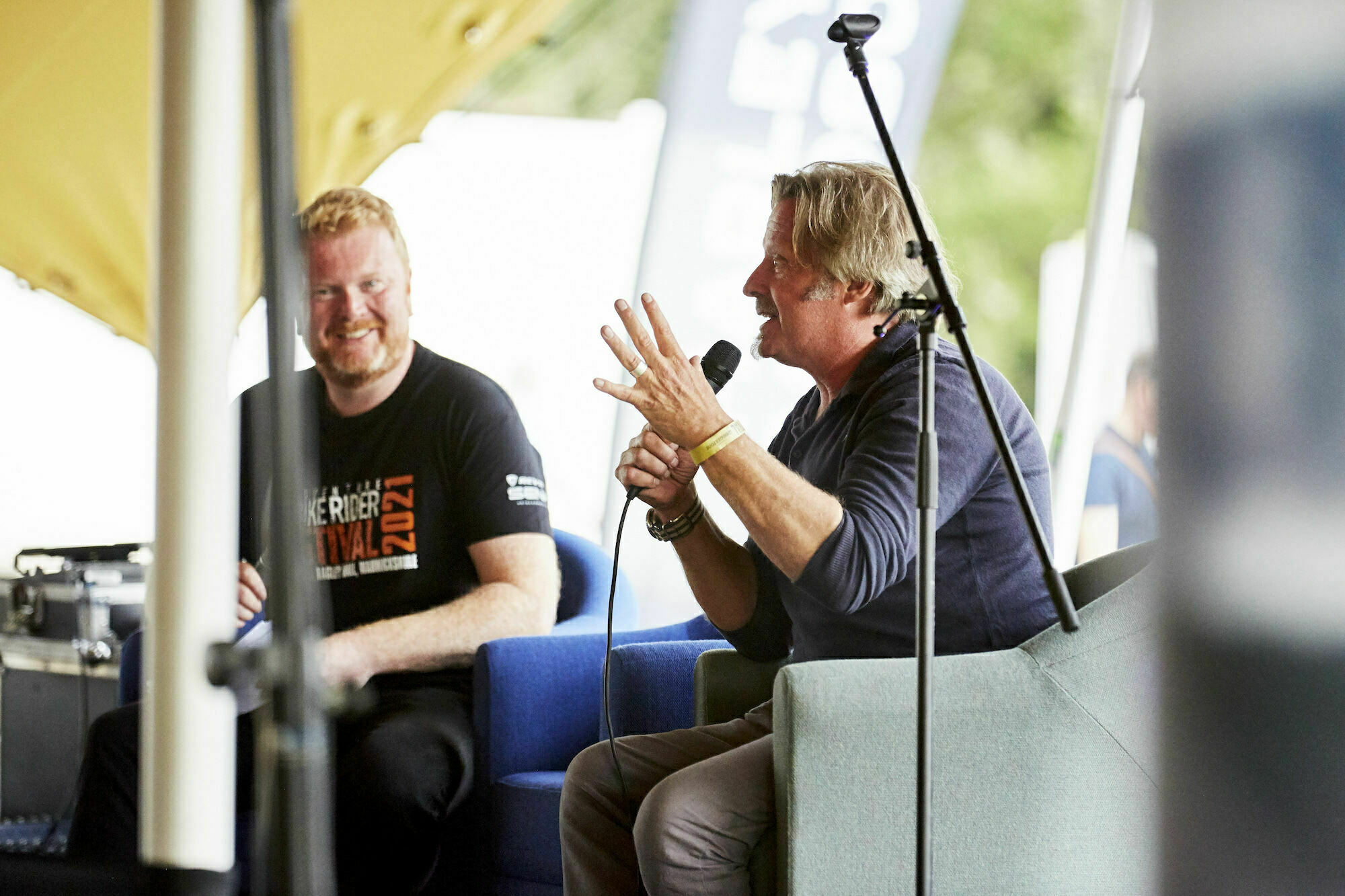 guest-speakers Charley Boorman speaking on the main stage at the Adventure Bike Rider Festival