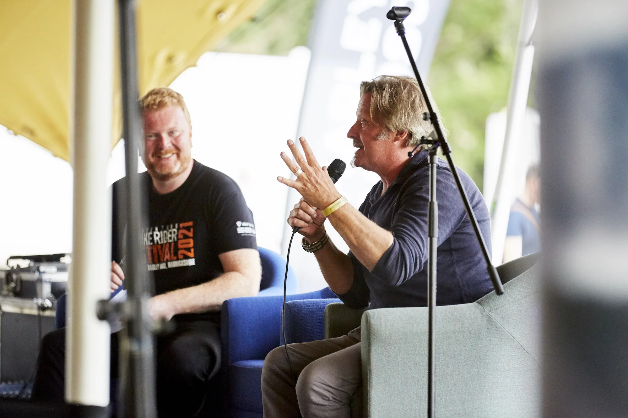 Charley Boorman speaking on the main stage at the Adventure Bike Rider Festival