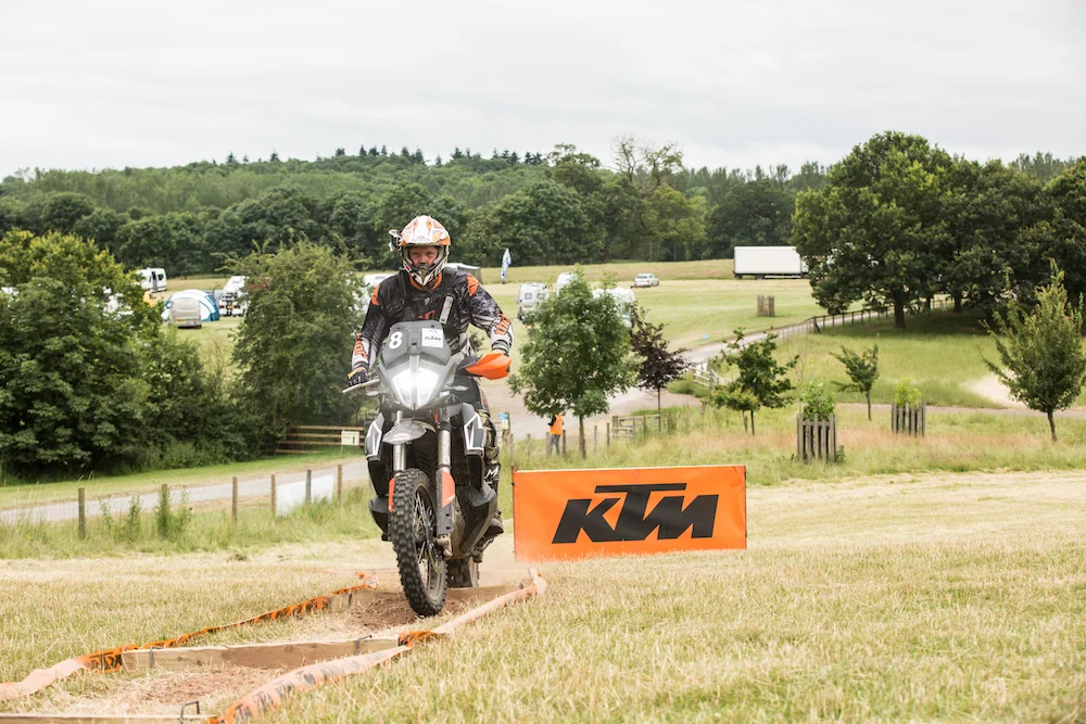 A man riding a KTM motorcycle in the Ragley Hall Estate