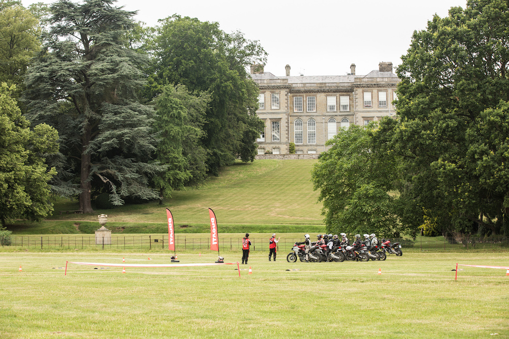 An off-road motorcycle school with Ragley Hall in the background