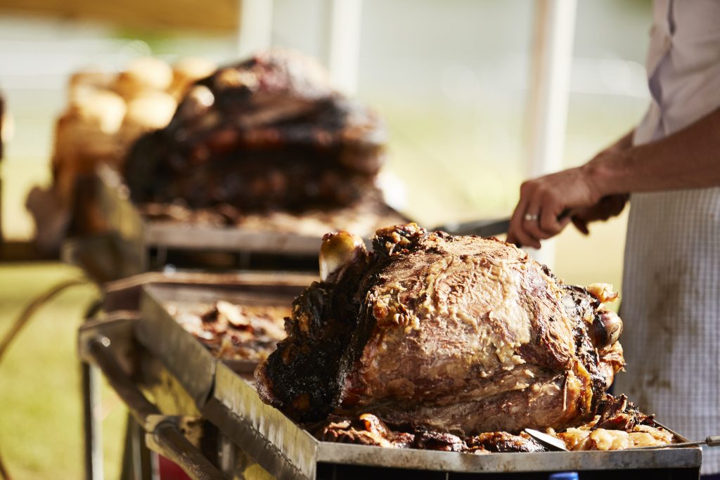 A chef carves up a joint of beef
