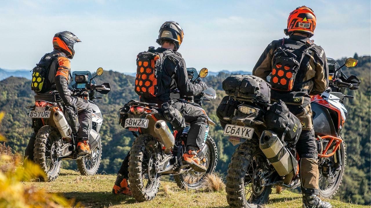 Enduro riders with Kriega luggage stopping on a motorbike ride