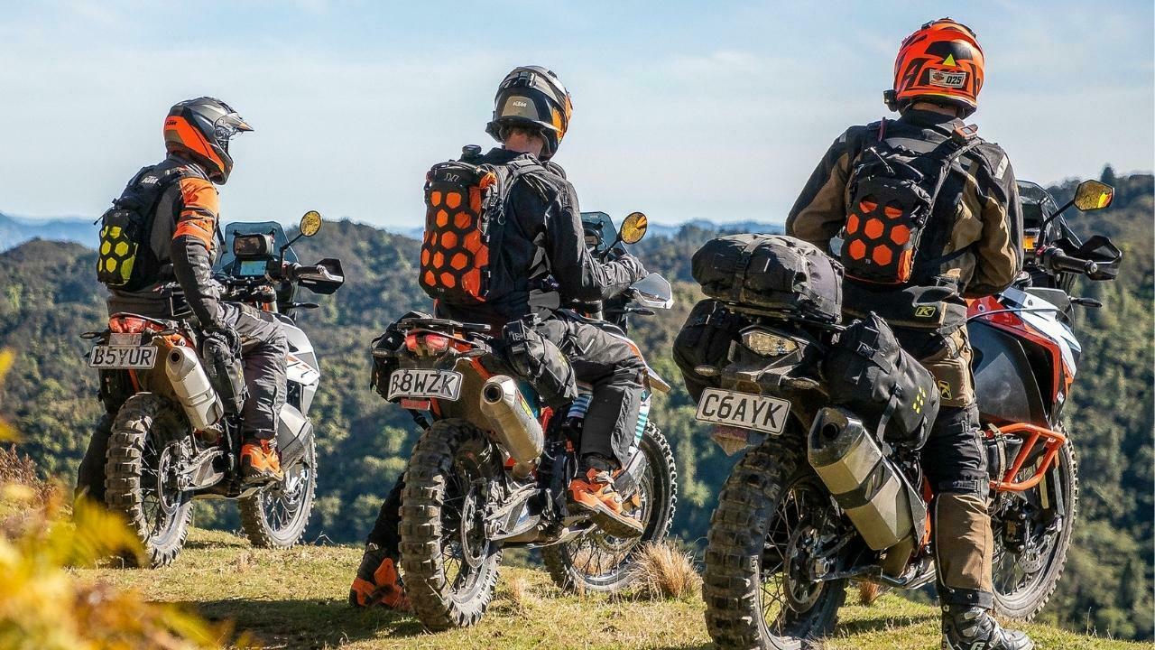 3 Enduro riders with Kriega luggage stopping on a motorbike ride