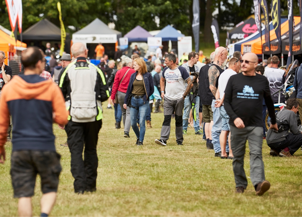 14 Visitors shopping for the latest riding gear at the exhibitor village