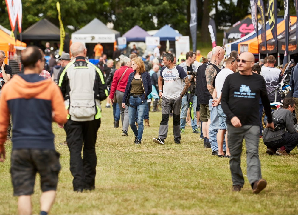 Visitors shopping for the latest riding gear at the exhibitor village