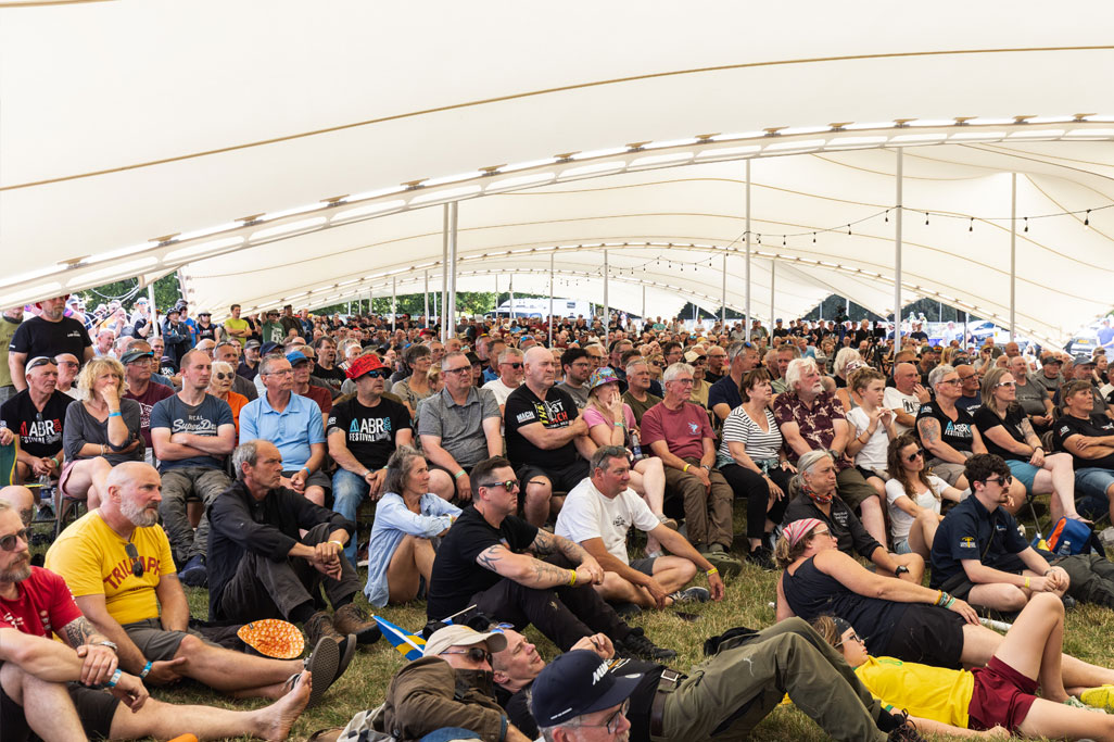 The Ducati Stage is the hub of inspiring talks at the ABR Festival Two visitors drinking a beer at the ABR Festival